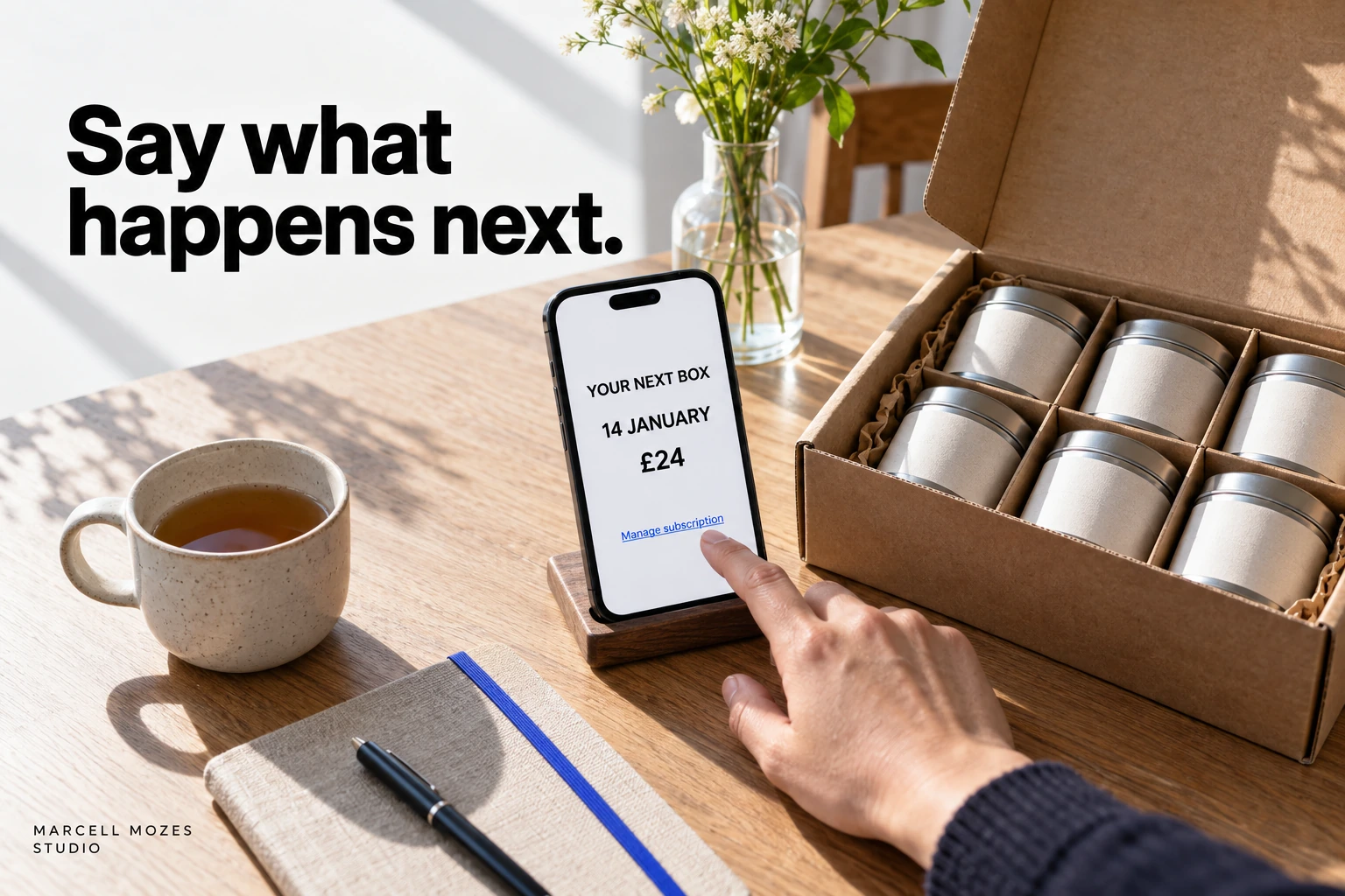 Say what happens next. A hand touches a phone beside a subscription box. The fictional message shows Your next box, 14 January, £24 and Manage subscription.